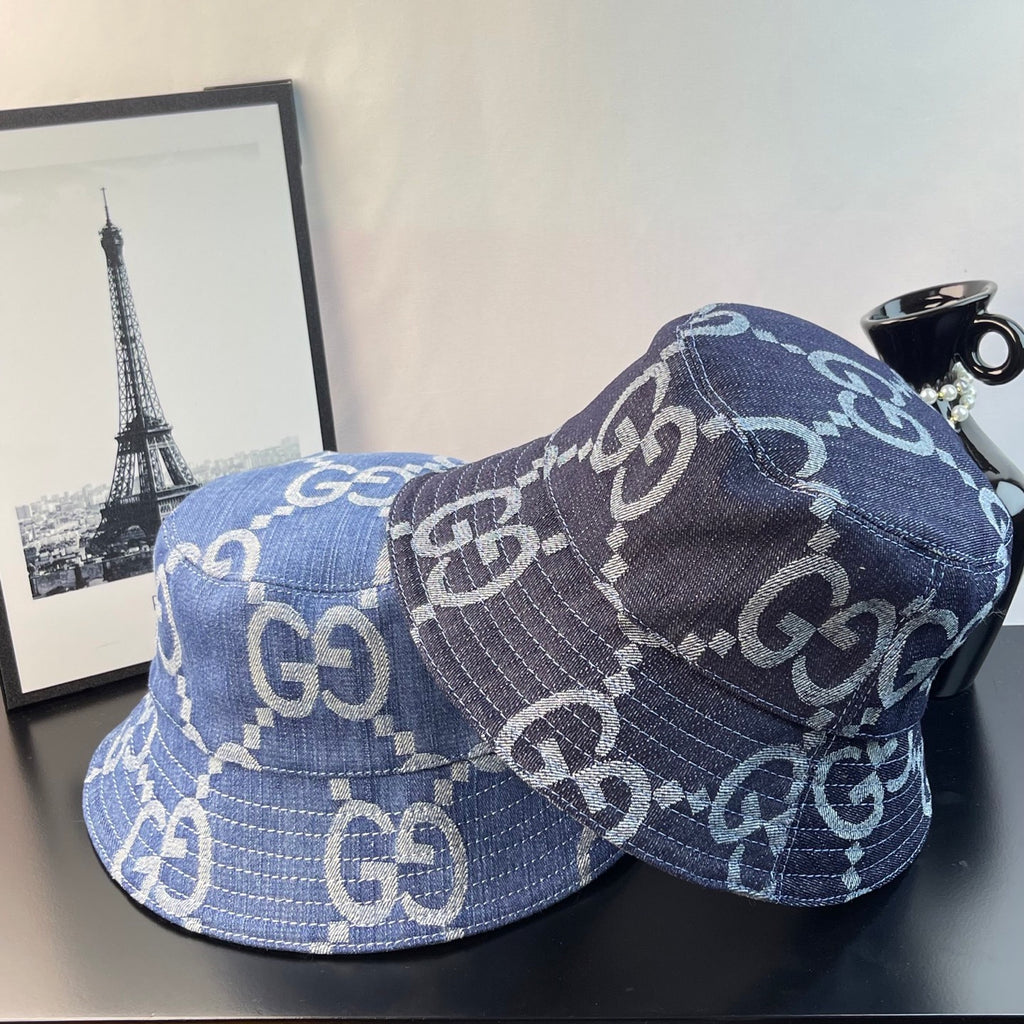 Gucci GG denim bucket hat in blue with repeating monogram print, brim and side