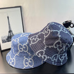Gucci GG denim bucket hat in blue with repeating monogram print, brim and side