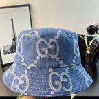 Gucci GG denim bucket hat in blue with repeating monogram print, close side