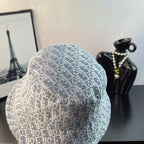Dior bucket hat in light blue with white monogram pattern, side view