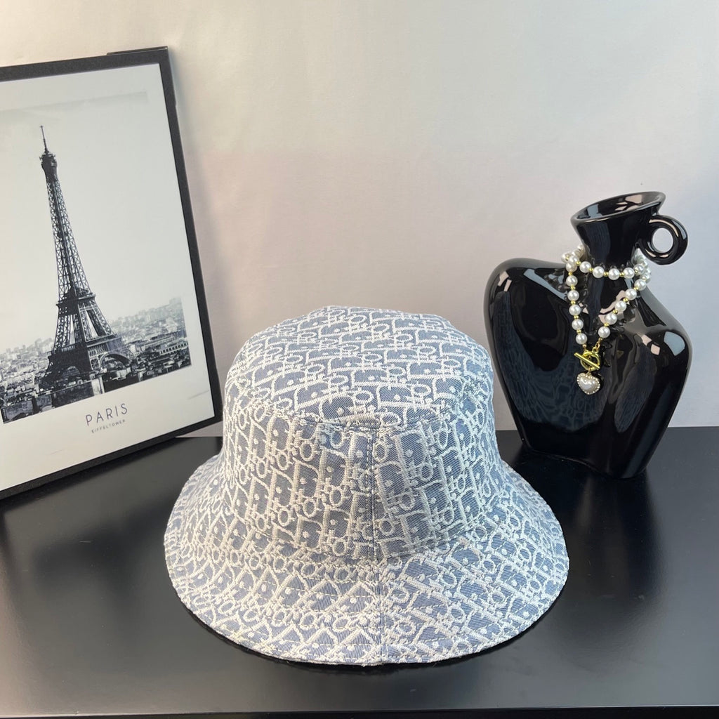 Gucci bucket cap with light blue monogram pattern, wide brim