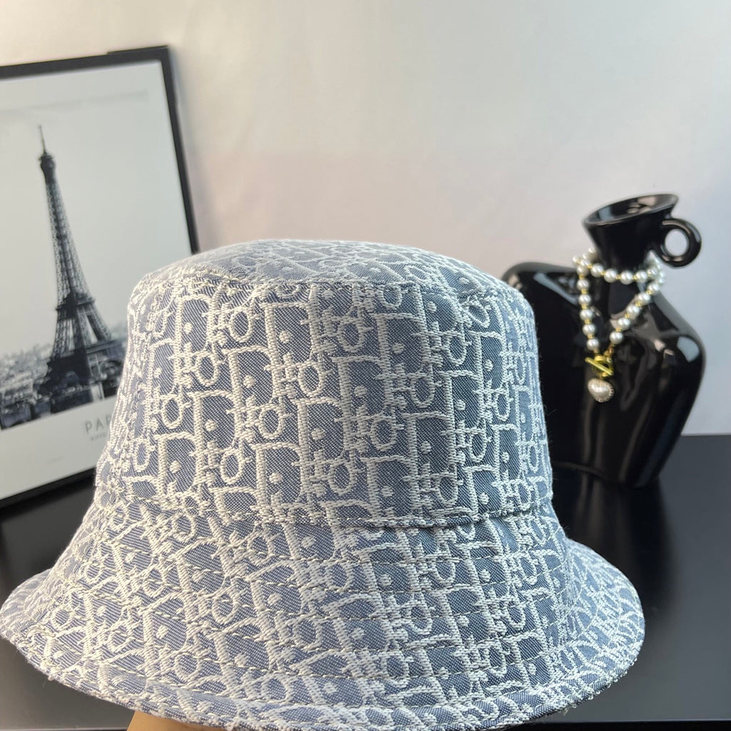 Gucci bucket cap with light blue monogram pattern, front close-up, wide brim