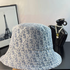 Gucci bucket cap with light blue monogram pattern, front close-up, wide brim