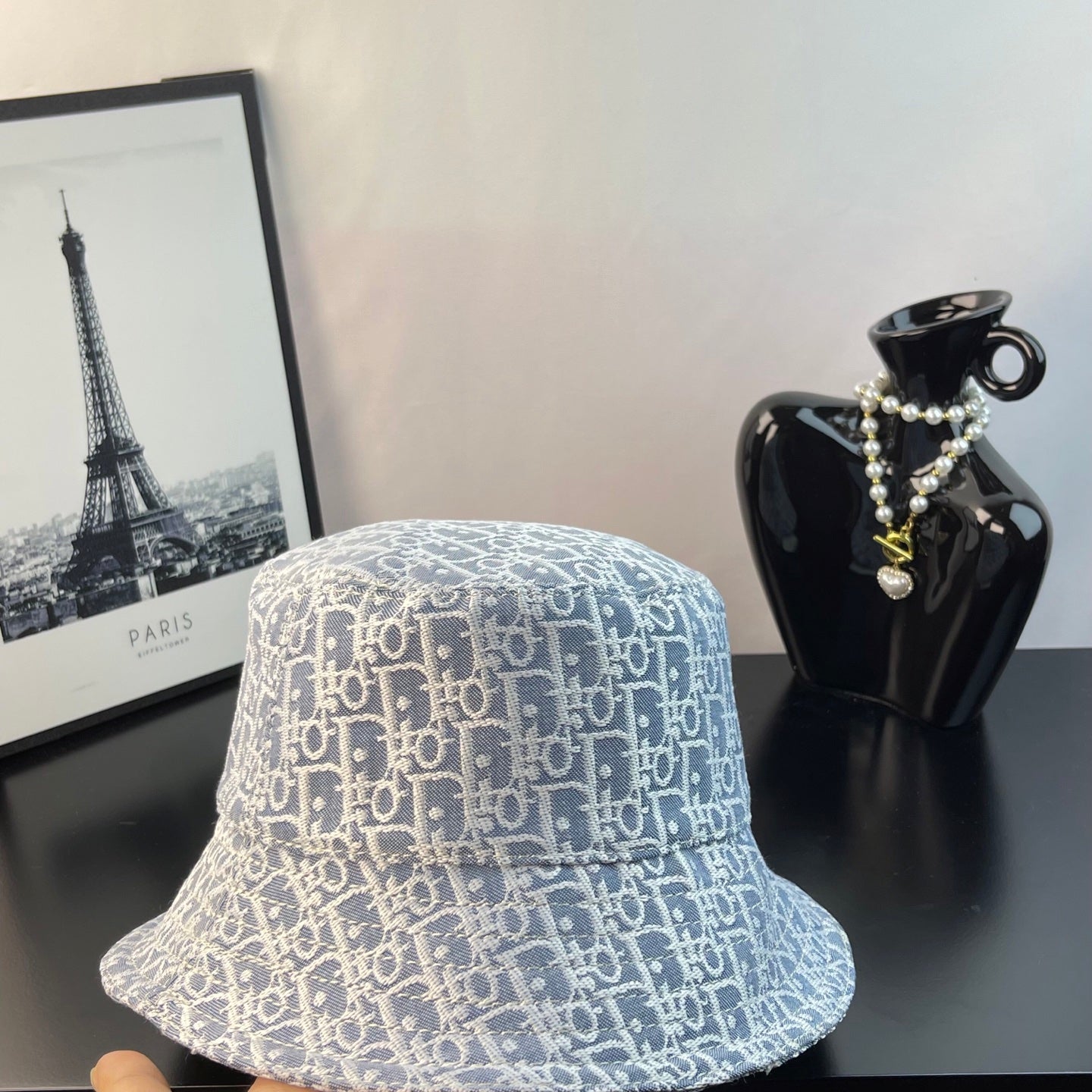 Dior bucket hat in light blue with white monogram pattern, front view