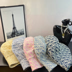Dior monogram bucket hats set in yellow, pink, light blue, and navy blue