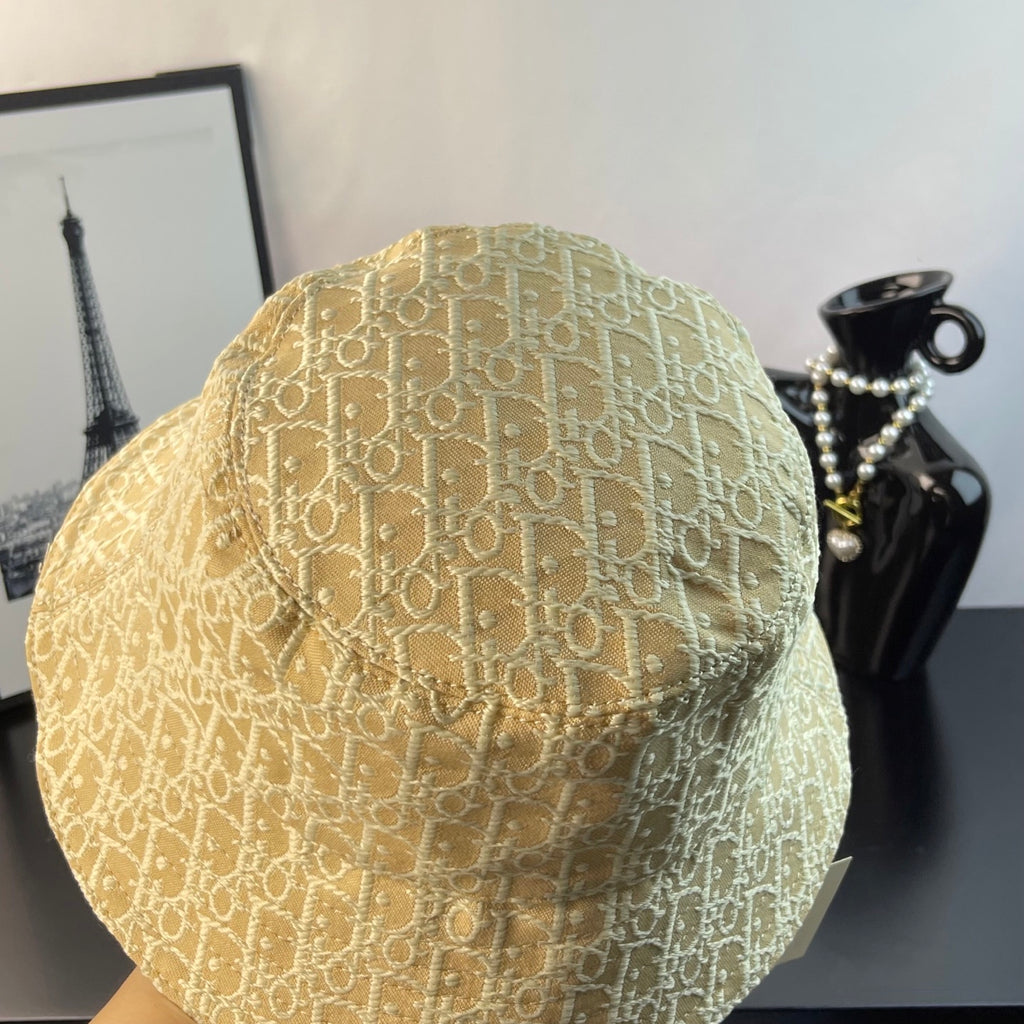 Dior monogram bucket hat in light gold, angled view showing stitched crown