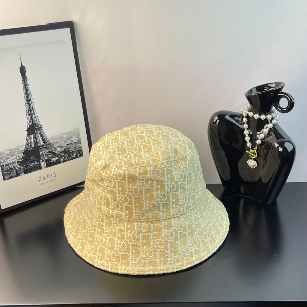 Bucket cap in yellow with allover monogram pattern