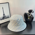 Dior monogram bucket cap in light blue with gold allover pattern