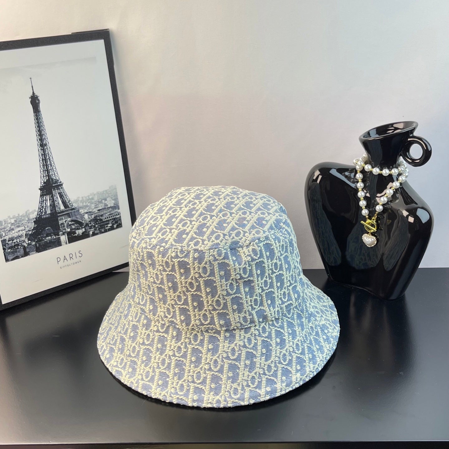 Dior monogram bucket cap in light blue with gold allover pattern