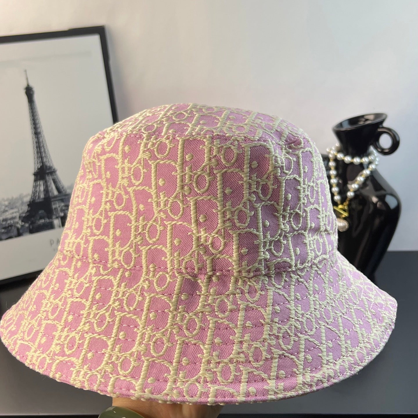Pink Dior monogram bucket hat, close-up of patterned crown and wide brim