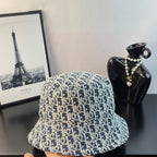 Dior monogram bucket hat in blue with gold letters pattern