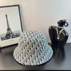 Dior monogram bucket hat in blue with gold pattern and wide brim