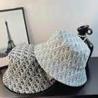 Dior monogram bucket hat in blue with gold pattern, two angles shown