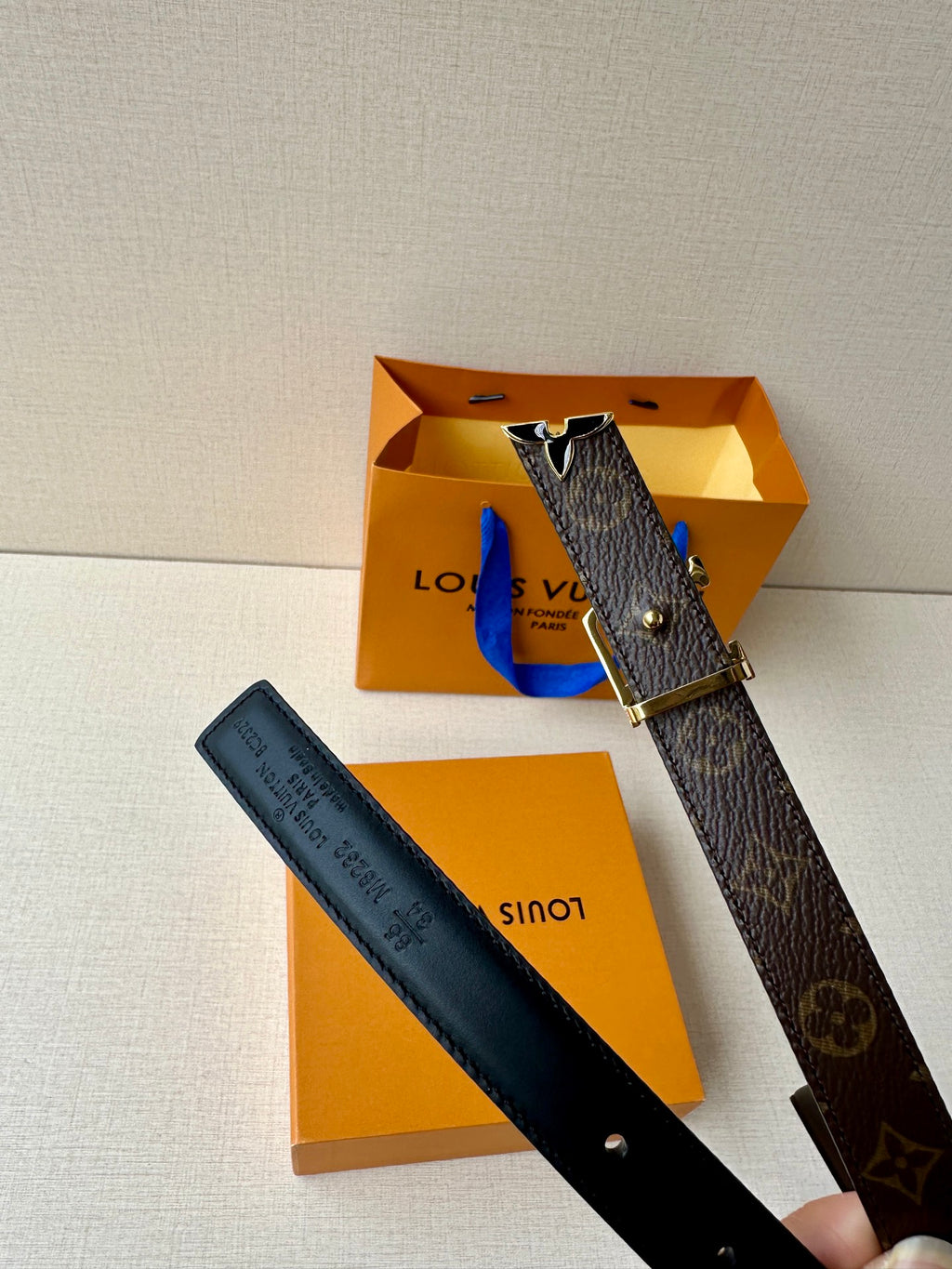 Louis Vuitton belt set with monogram canvas and dark blue leather straps, gold-tone buckles
