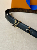 Louis Vuitton belt close-up with dark blue strap and gold-tone LV buckle