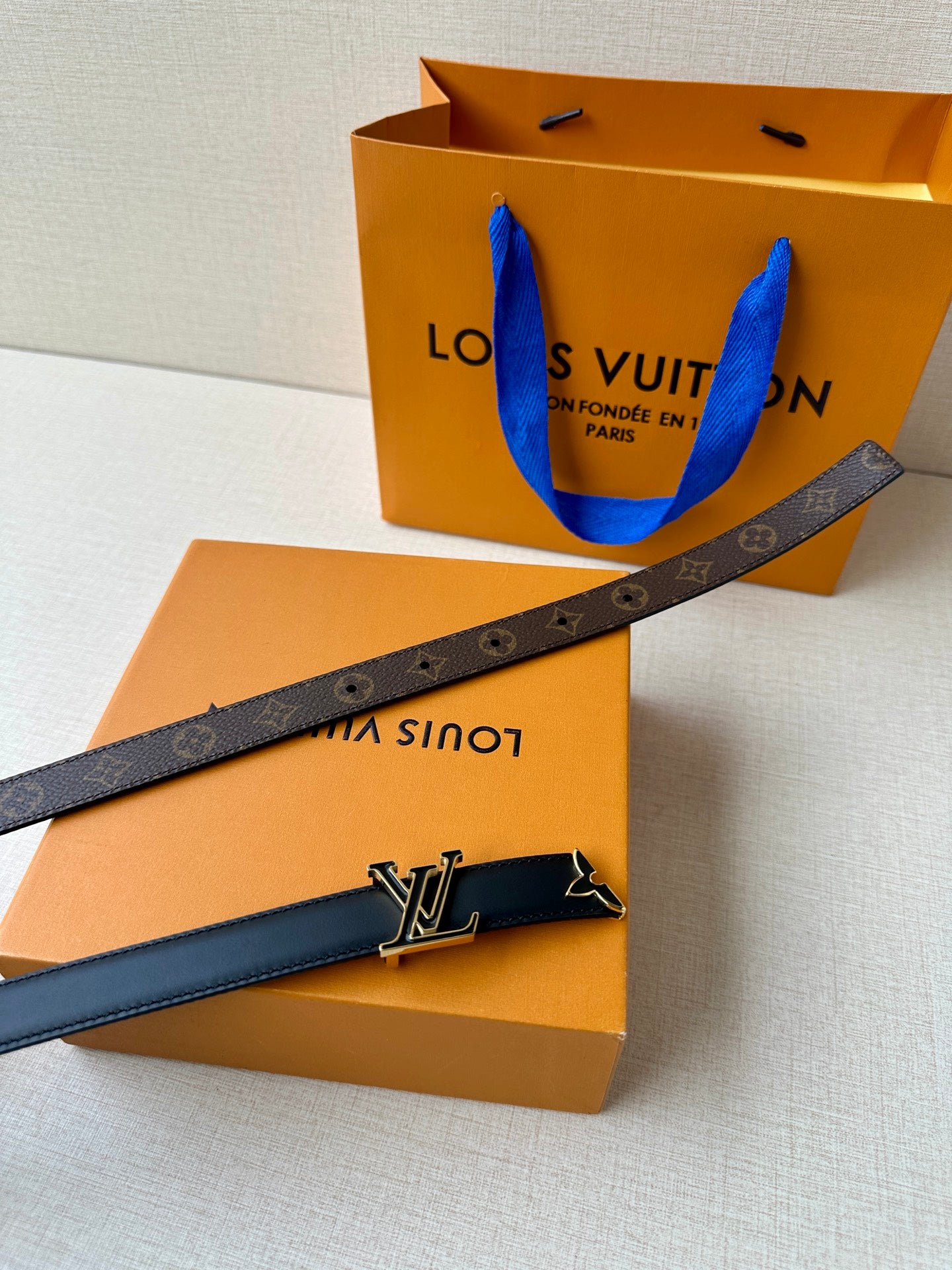 Louis Vuitton belt with monogram canvas strap and gold-tone LV buckle