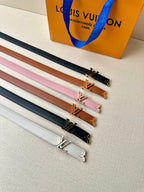 Set of leather belts with gold-tone buckles in dark, navy, pink, tan, and white.
