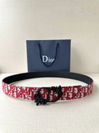 Dior belt with red-and-black monogram pattern and black buckle with floral detail.