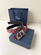 Dior belt with red monogram fabric and silver-tone buckle with engraved medallion