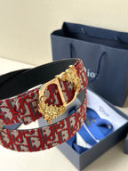 Red monogram belt with gold-tone lion-head buckle and black leather strap
