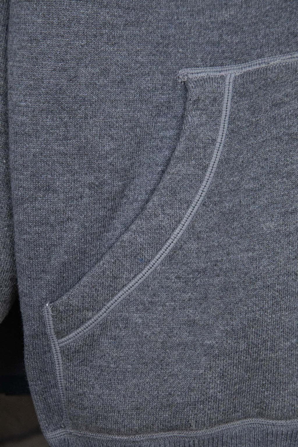 Heather gray hoodie with curved welt pocket opening and ribbed side seams