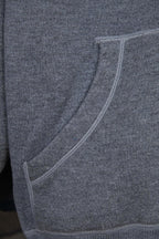 Heather gray hoodie with curved welt pocket opening and ribbed side seams