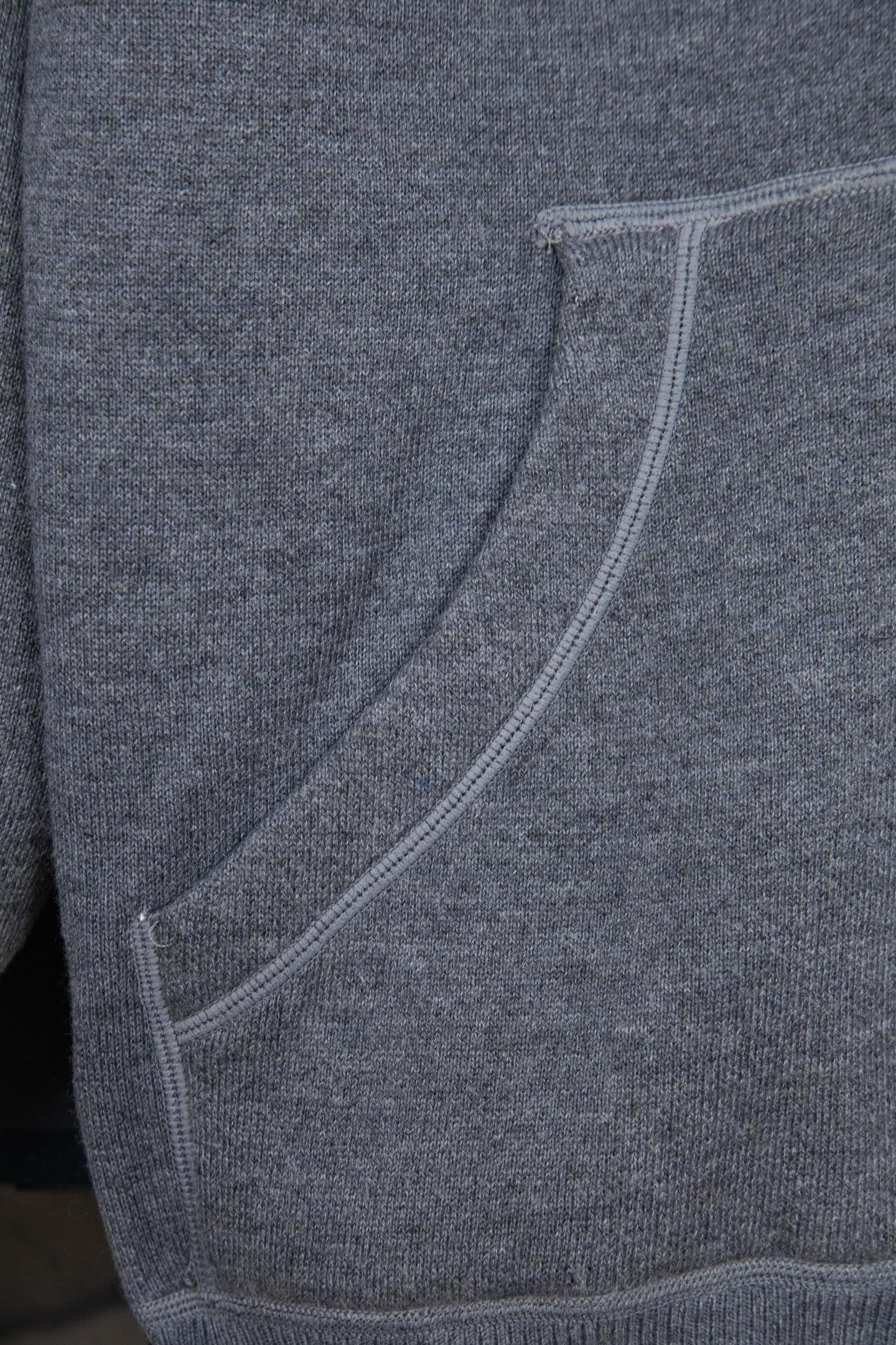 Heather gray hoodie with curved welt pocket opening and ribbed side seams