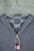 Heather gray hoodie neck with logo print hood lining and zipper pull tag
