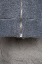Heather gray hoodie front showing full zip and ribbed hem at bottom