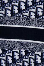 Lower knit section with navy banding and small monogram pattern