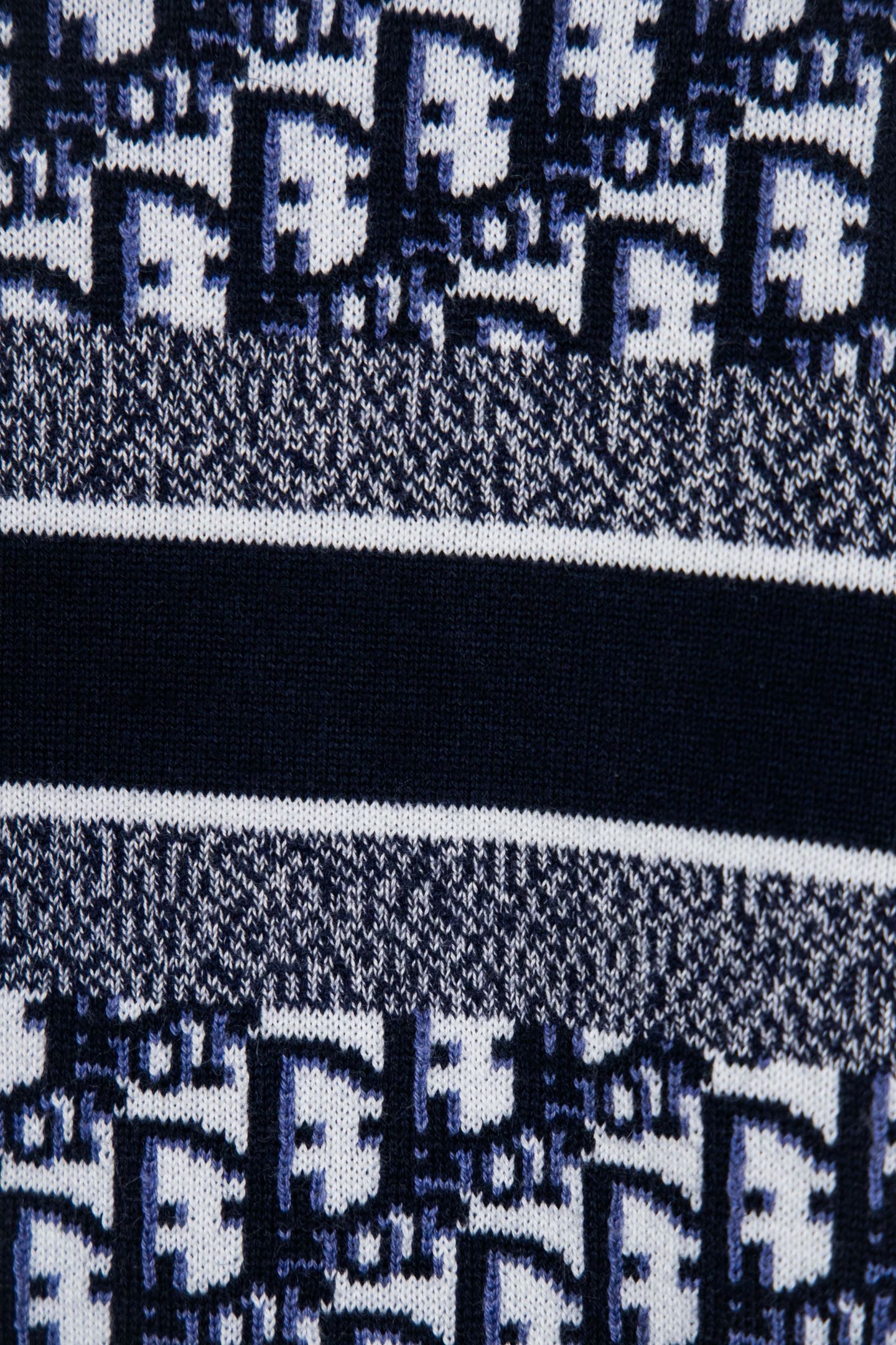 Lower knit section with navy banding and small monogram pattern