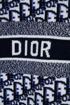 Logo stripe on knit sweater showing DIOR in large letters