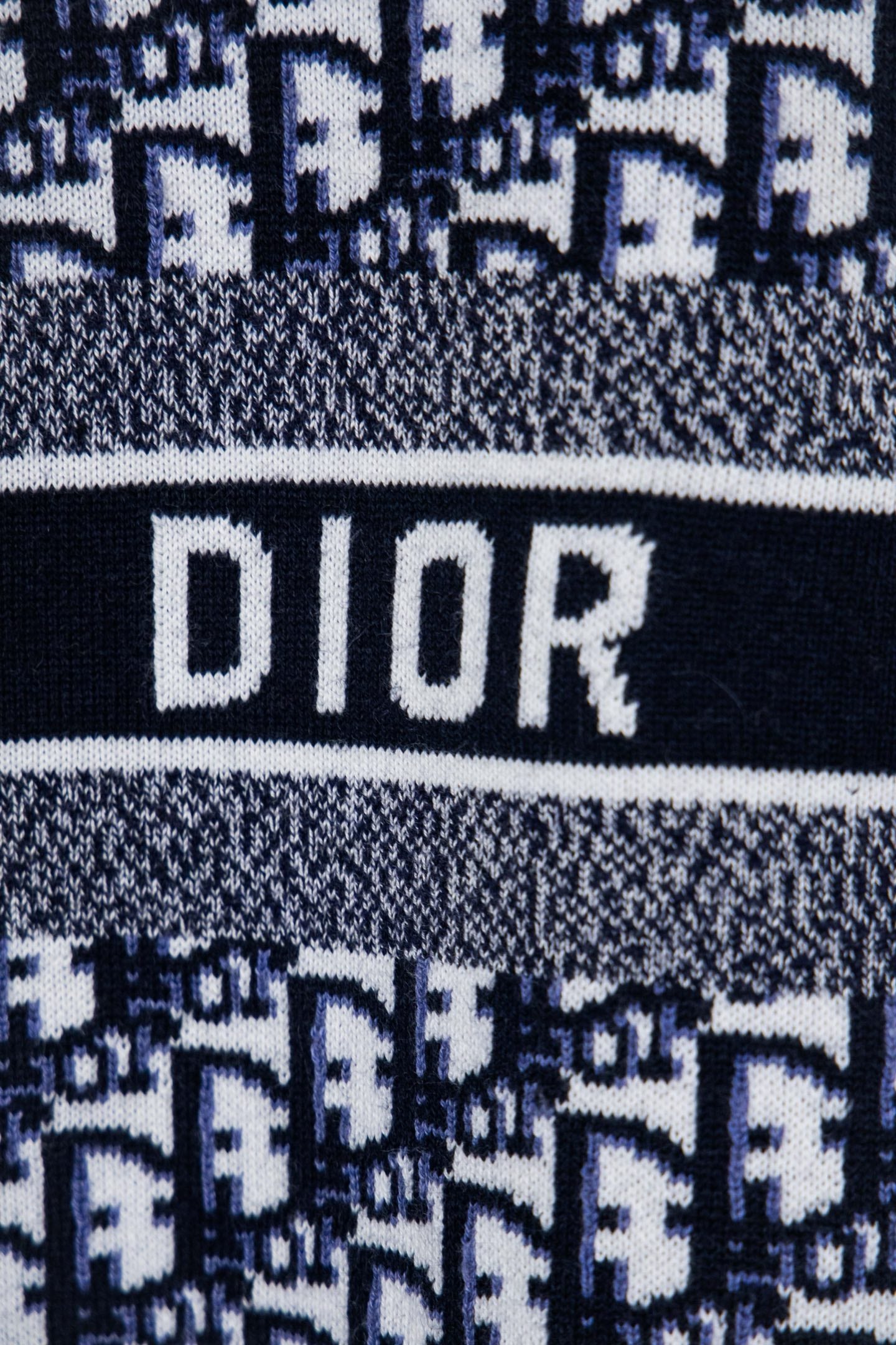 Logo stripe on knit sweater showing DIOR in large letters