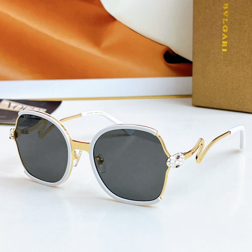 Sunglasses with white frames and gold-tone arms, dark gray gradient lenses