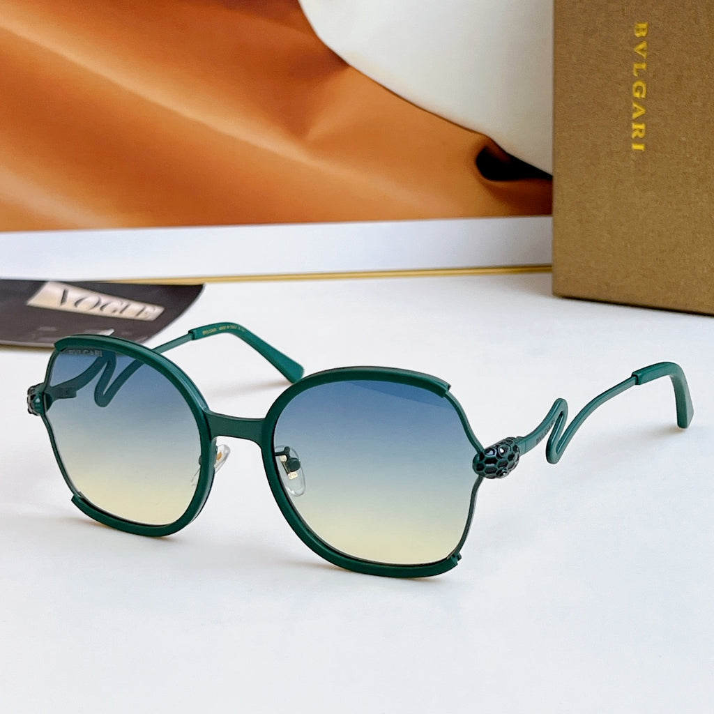 Sunglasses with dark green frames and gold-tone arms, blue-green gradient lenses