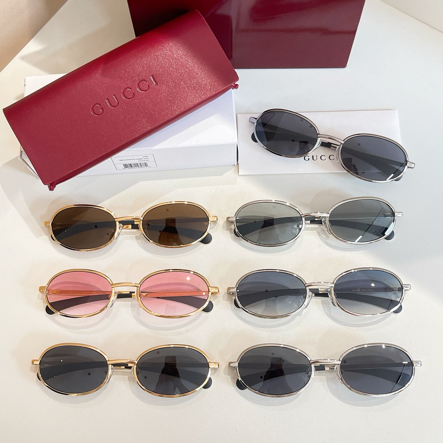 Gucci sunglasses set with multiple frames and dark tinted lenses