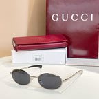 Gucci sunglasses with dark lenses and silver-tone metal round frames