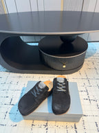 Balenciaga black lace-up slip-on shoes, low-profile design with lace-up front.