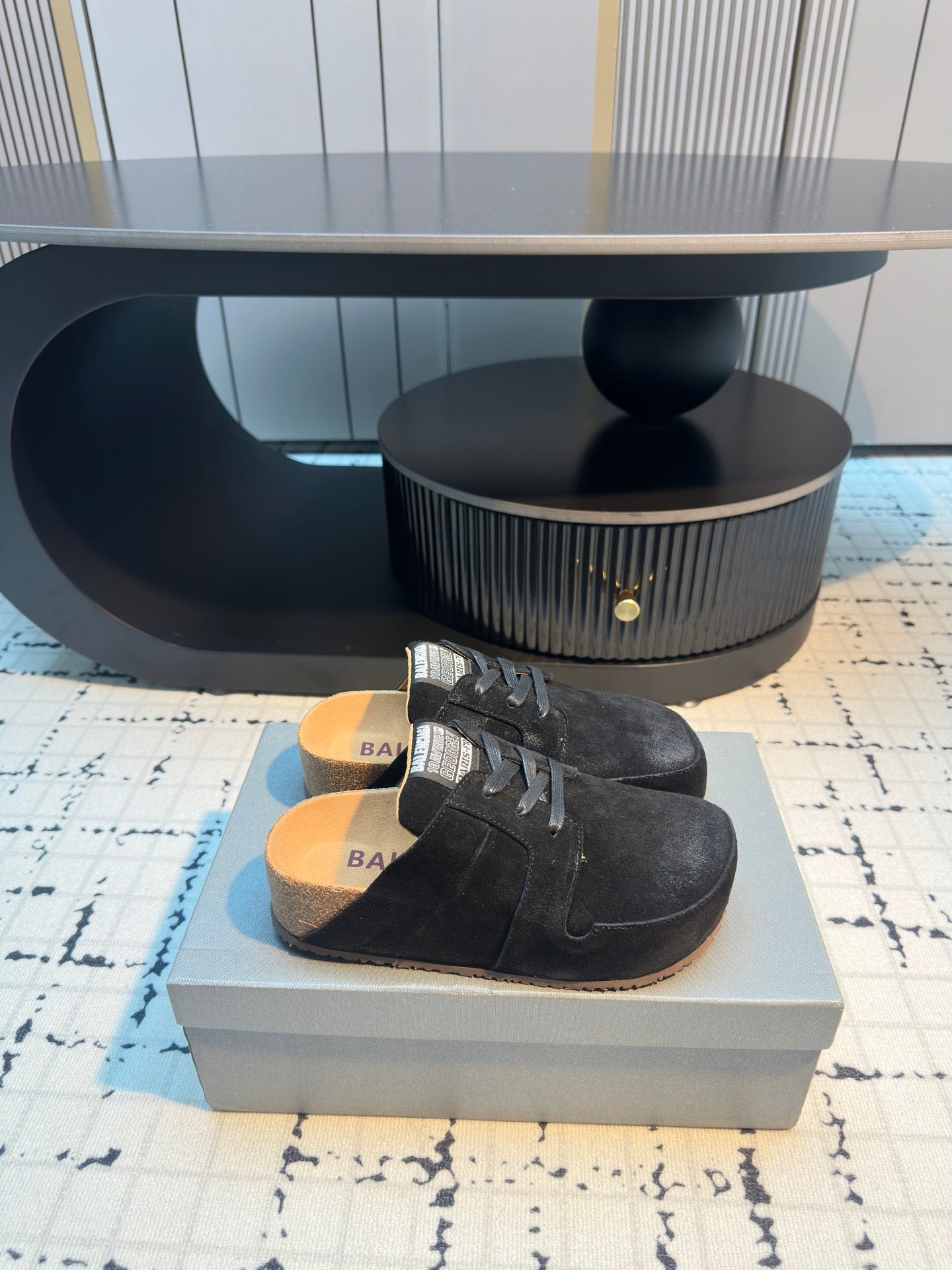 Balenciaga black lace-up slip-on shoes with printed insole and cushioned footbed.