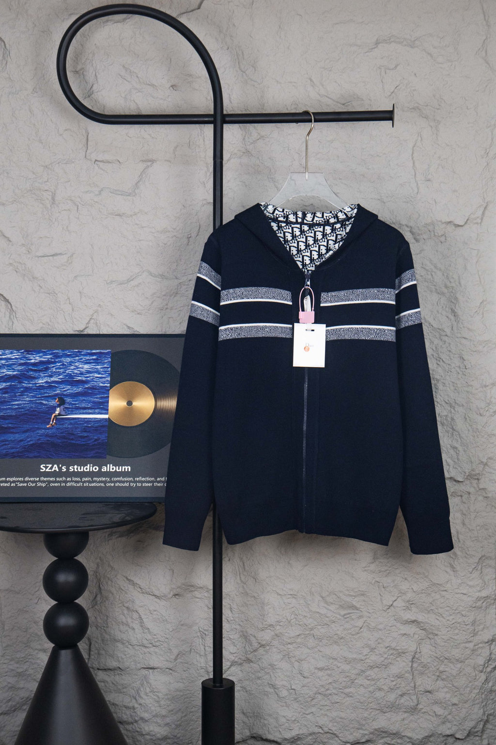 Navy zip-up cardigan with white stripe detail and hooded collar