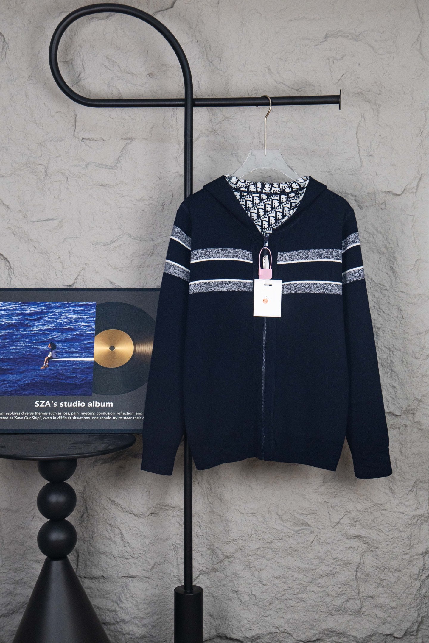 Navy zip-up cardigan with white stripe detail and hooded collar