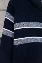 Navy knit cardigan sleeve with white horizontal stripe band