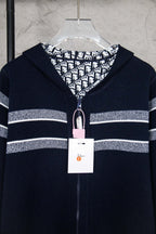 Navy zip-up cardigan with patterned hood lining and front zipper