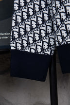 Dior knit jacket lower body with navy ribbed hem and repeating monogram pattern