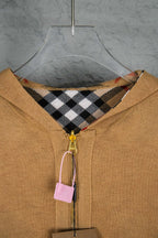 Burberry tan hooded knit jacket showing check interior hood and gold zipper pull