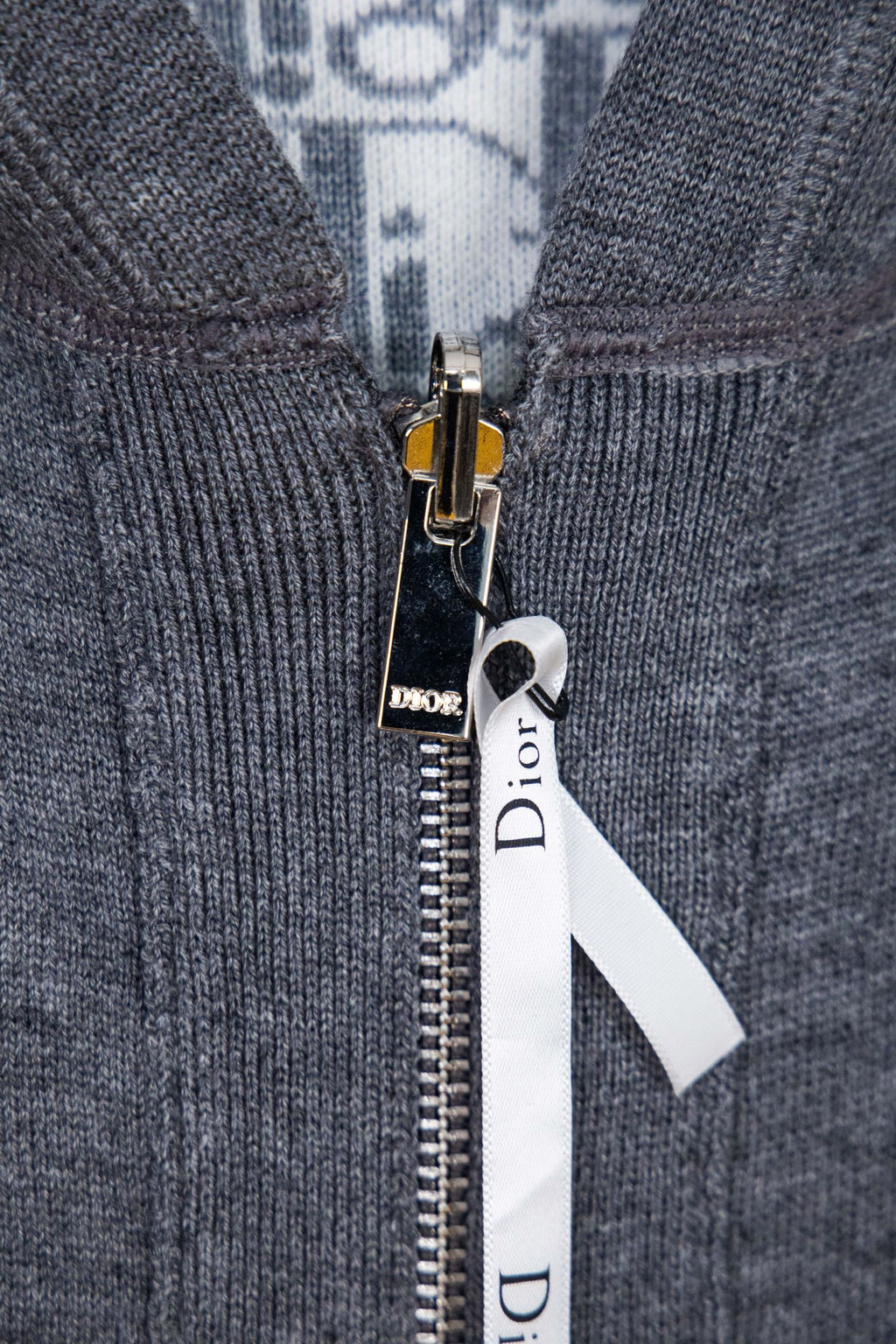 Zip hoodie close-up of zipper pull with small Dior logo badge