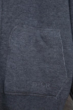 Heather gray front pocket with stitched edges and small DIOR text