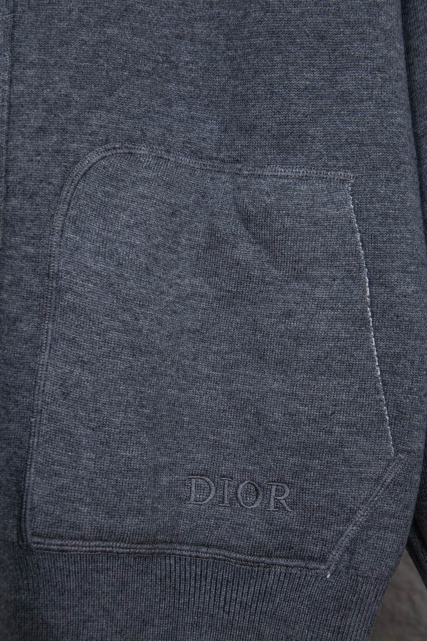 Heather gray front pocket with stitched edges and small DIOR text