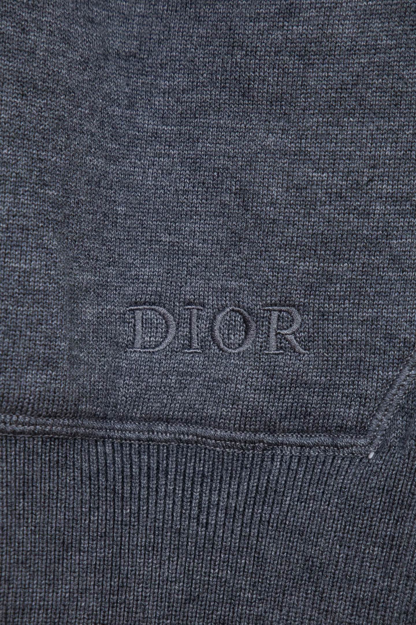 Heather gray hoodie cuff with subtle DIOR embroidery on the hem