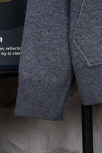 Heather gray hoodie sleeve with ribbed cuff and visible side seam